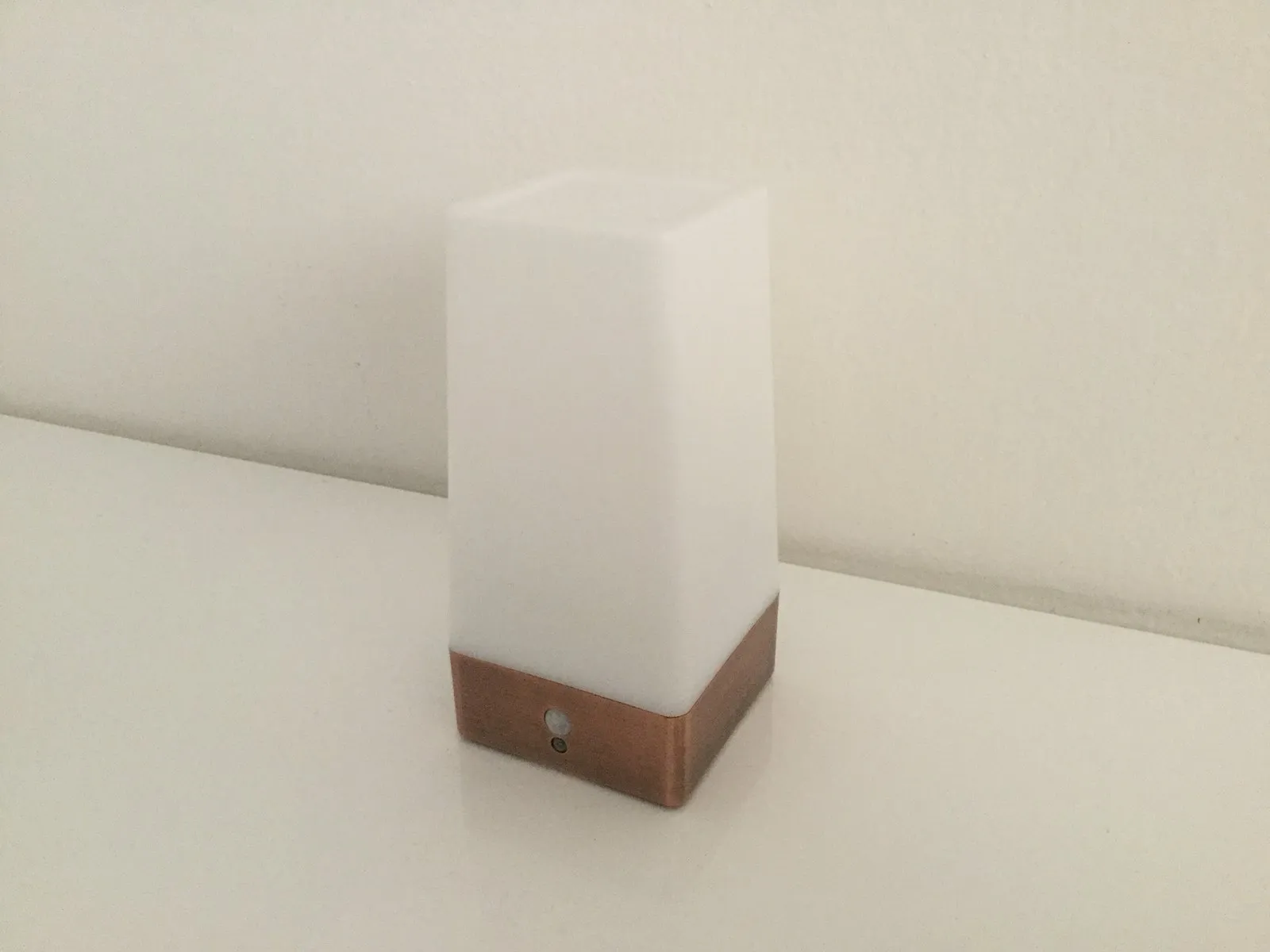 Sleep Phaser Mini prototype: a small cube-shaped lamp with a wooden base